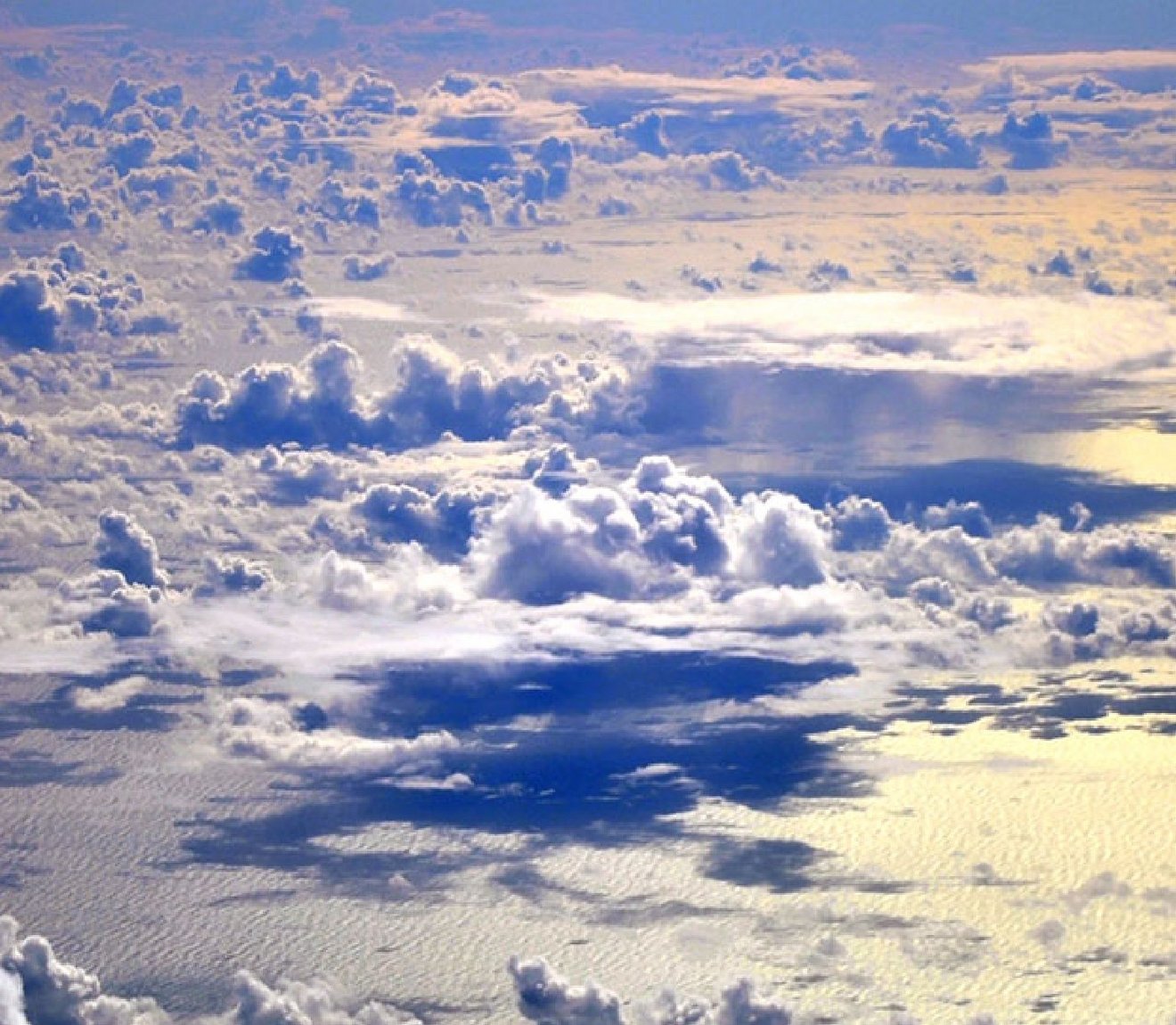 Photo of clouds and the ocean from above